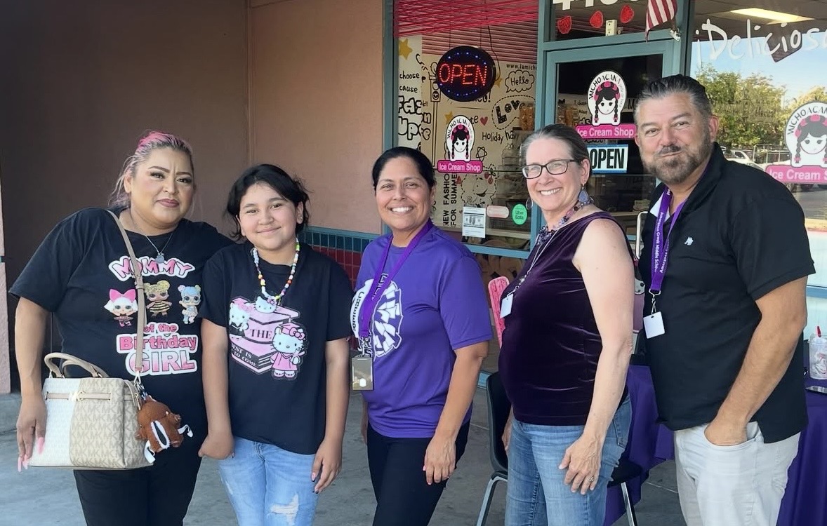 25-26 Principal and Assistant Principals with a student and parent 